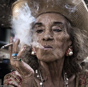 Smokes-a-lot-lady doesn't look quite this glamorous and probably has a few less teeth...